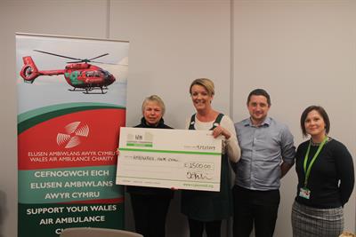 Members of CCG handing over a cheque to Wales air ambulance