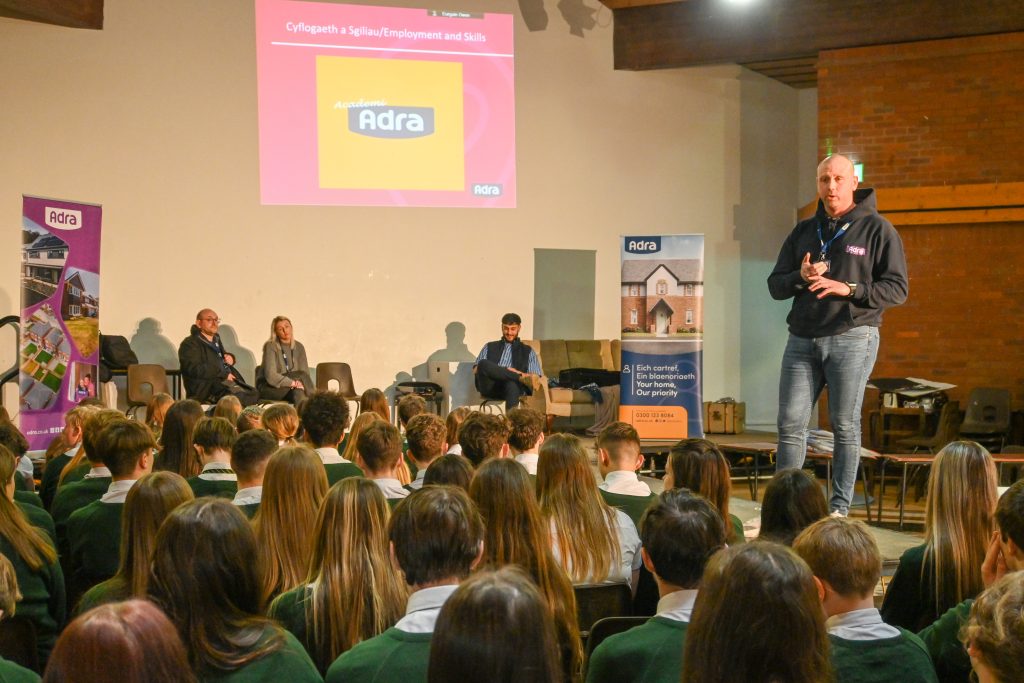 Sion from our Community Team in a school with pupils in the audience