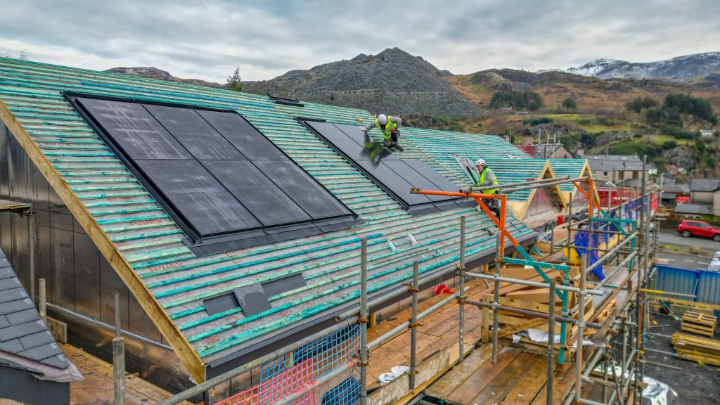 solar panels being installed on roof of a new build in Blaenau Ffestiniog