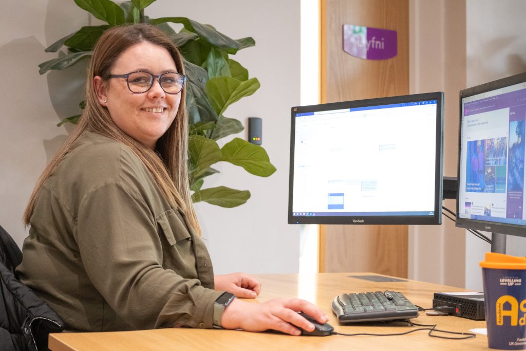 Daniella from academi adra working on her computer